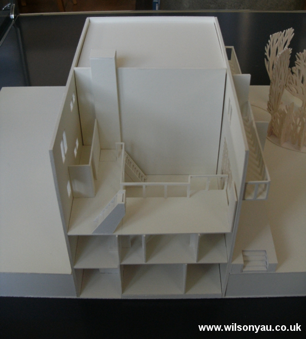 Model with roof and top floor removed to show mezzanine level and double-height living room