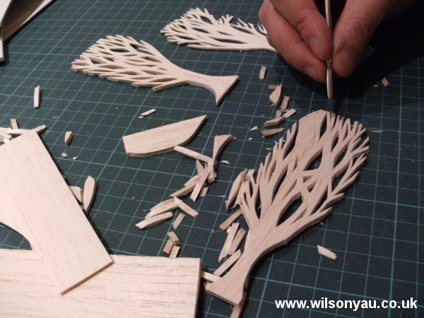 Trees being cut out of balsa wood